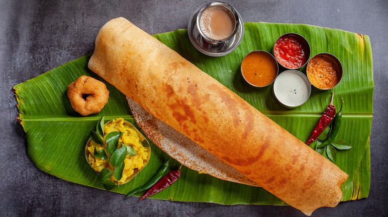 dosa and curries on banana leaf 
