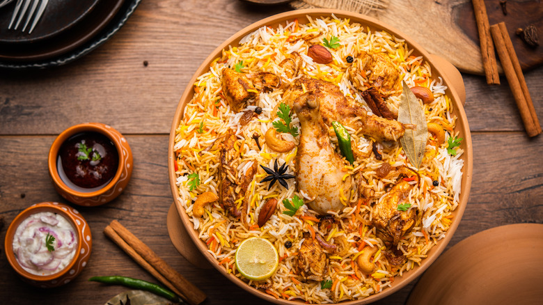 Chicken biryani in wooden bowl 