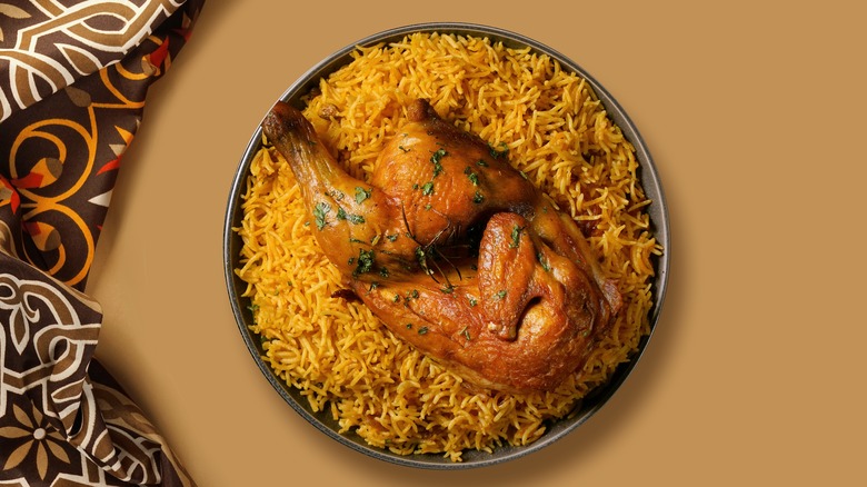 Chicken atop yellow rice 