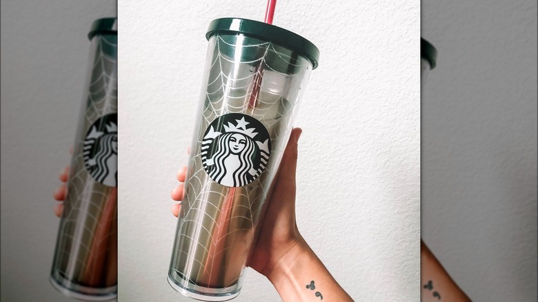 handheld Starbucks glitter spiderweb tumbler