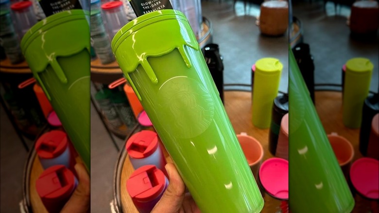 handheld Starbucks green drip tumbler