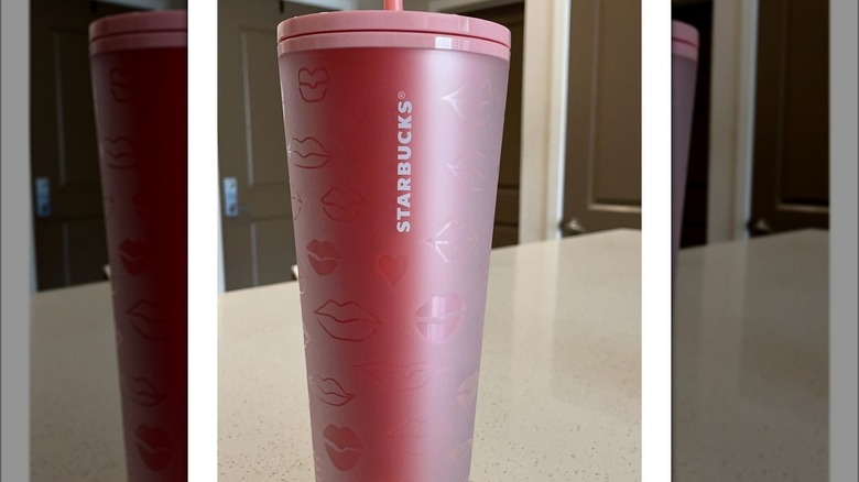 Starbucks red lips tumbler on table