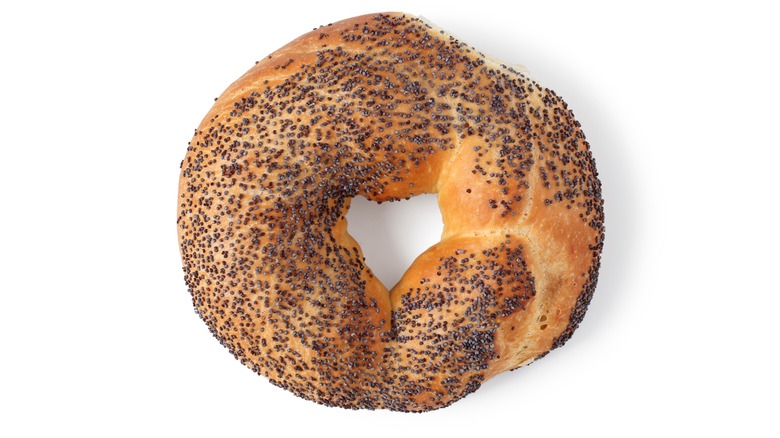 Poppyseed bagel on isolated white background