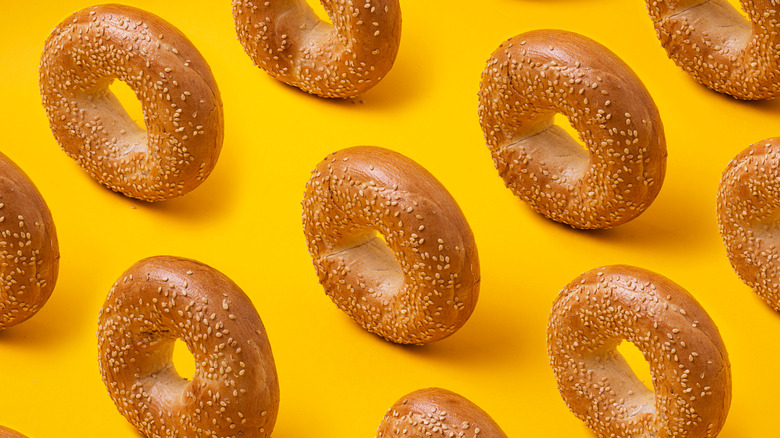 Sesame bagels on yellow background