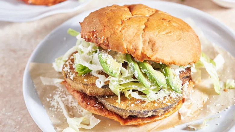 Fried Eggplant Pambazos (Mexican Guajillo-Soaked Sandwich) on white plate