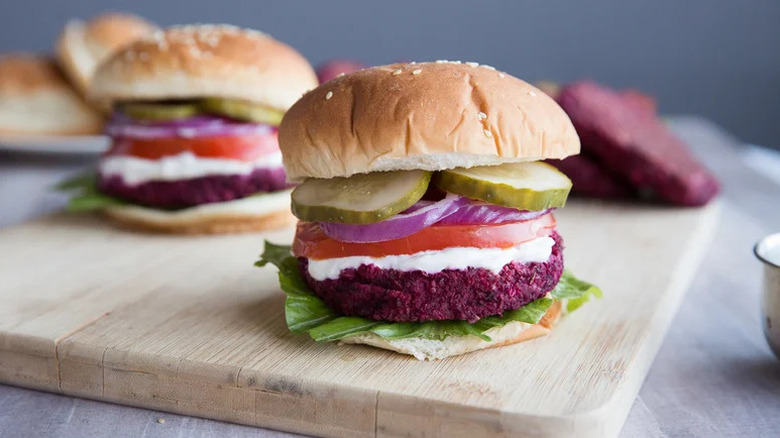 Hearty Beet and Bean Burgers on wooden cutting board