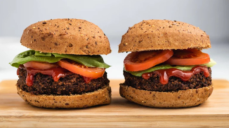 Hearty Black Bean Burgers on wooden cutting board