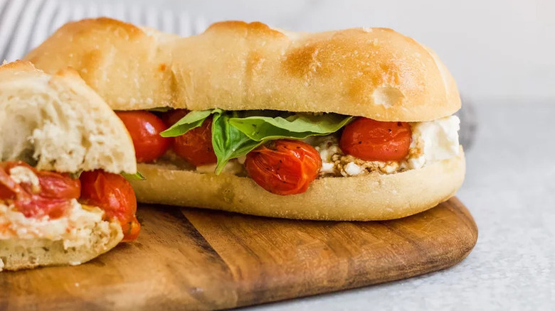 Roasted Caprese Sandwich on wooden cutting board
