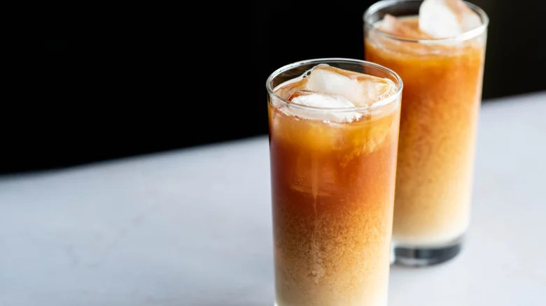 Thai tea glasses on counter