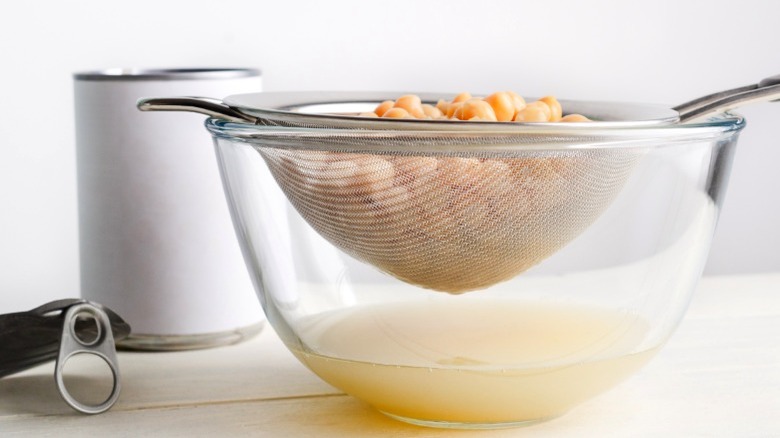 draining canned chickpea water