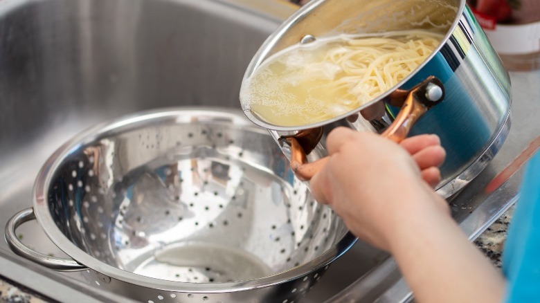 draining pasta water