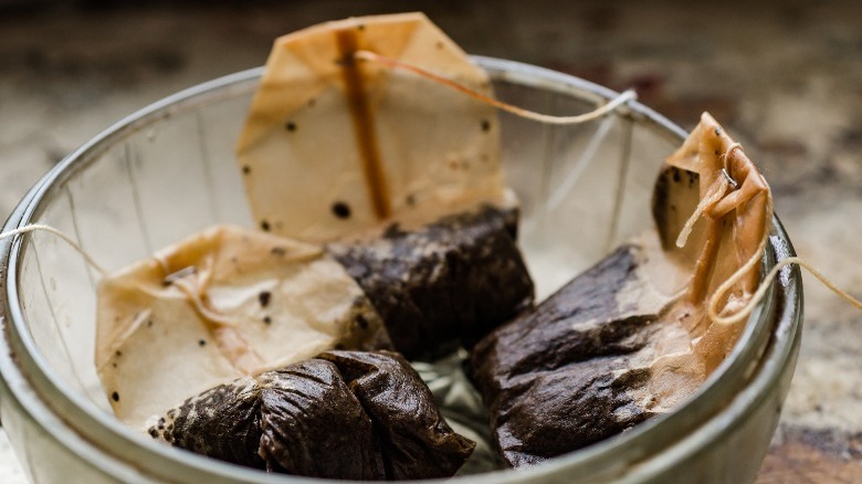 used tea bags in bowl