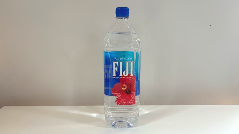 fiji water bottle on table