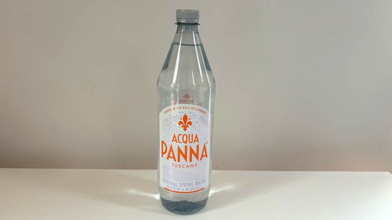 acqua panna water bottle on table