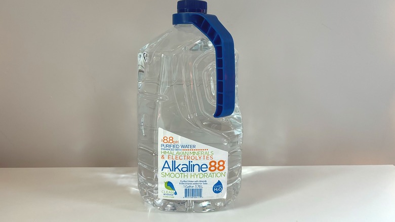 bottle of alkaline88 water on table