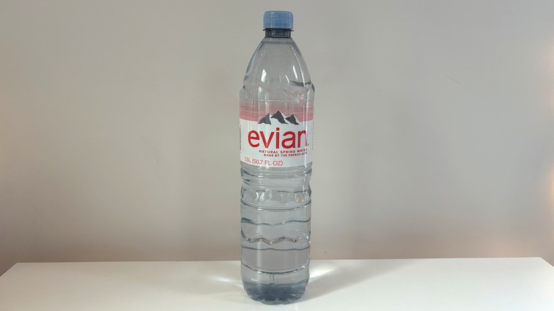 evian water bottle on table