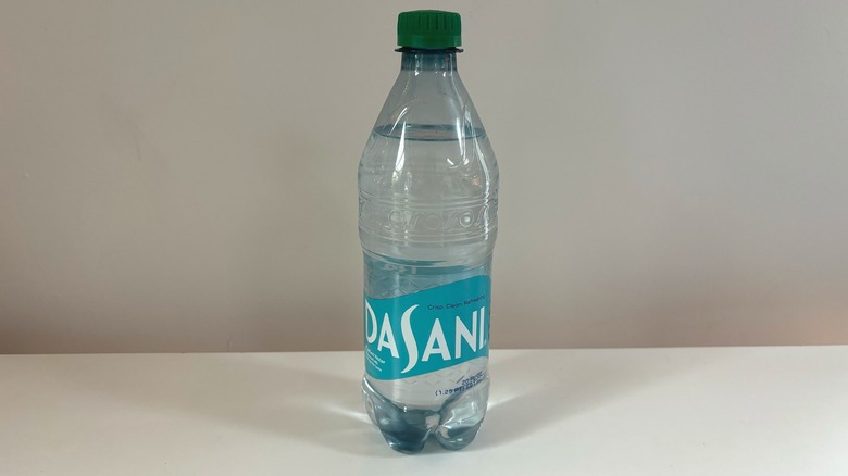 bottle of dasani water on table