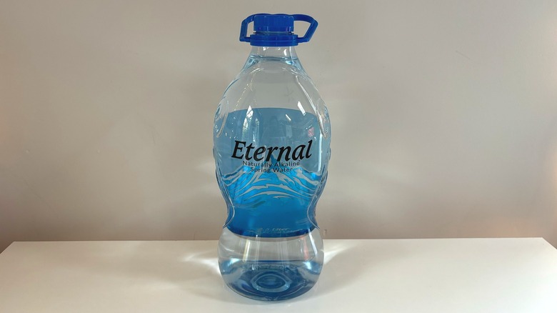 blue bottle of eternal water on table