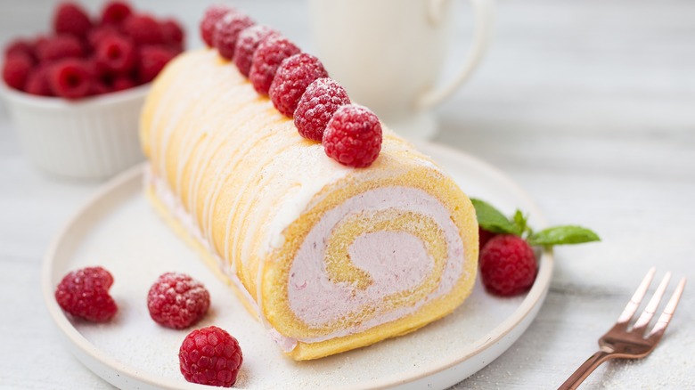 Raspberries on sponge roll