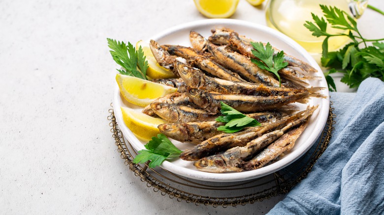 Fried anchovies on plate
