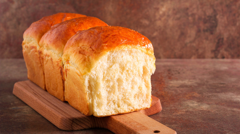 Milk bread loaf on board