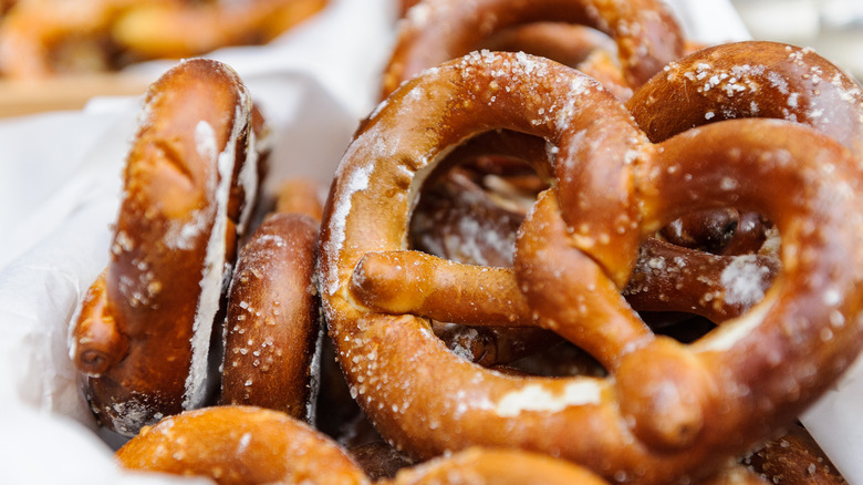 Soft pretzels stacked on white