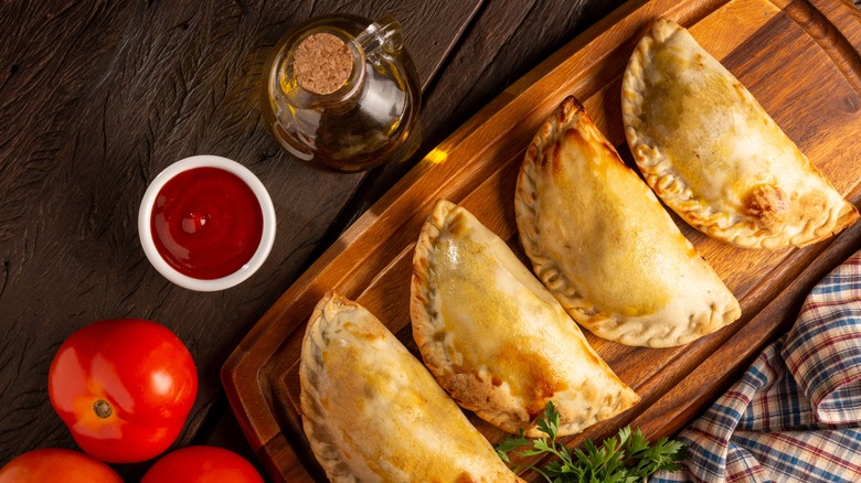 row of baked empanadas 