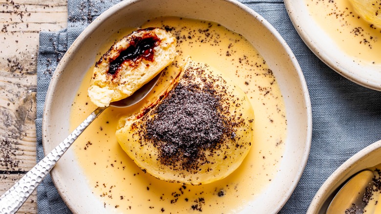 Germknödel sliced to show powidl inside on a dish