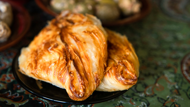 Two pastizzi on plate