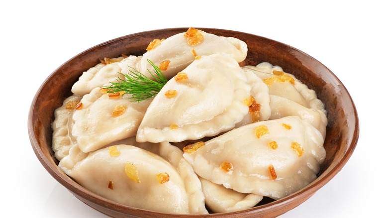 bowl of pierogi with onion