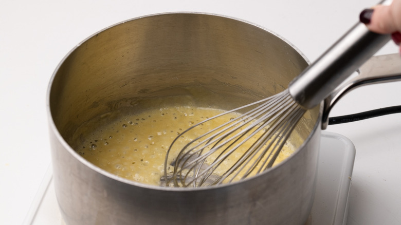 whisking roux in a saucepan