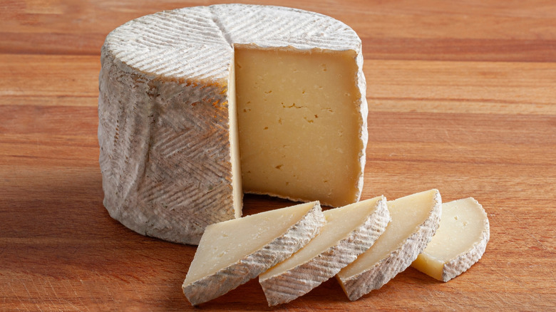 Spanish zamorano cheese wheel and slices