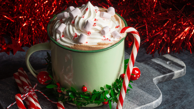 Festive mint hot chocolate drink with candy canes