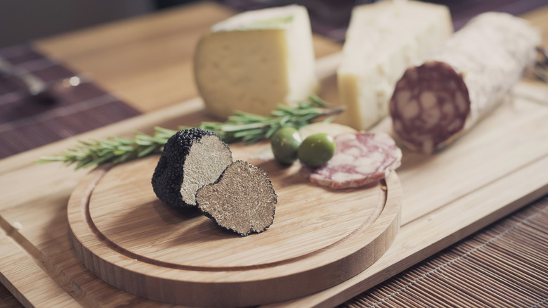 Truffles on board with cheese, meat