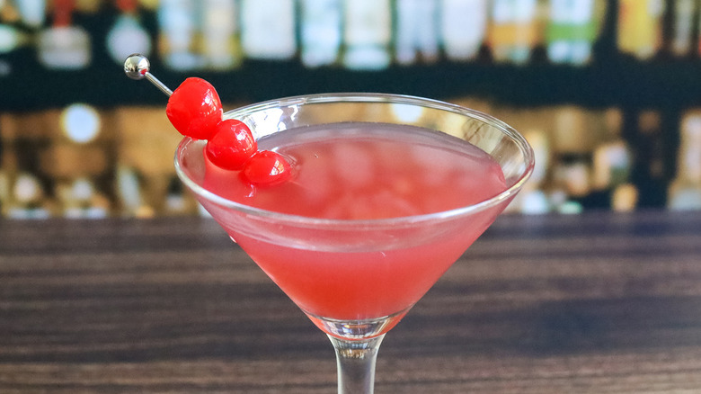 pink cocktail with maraschino cherries