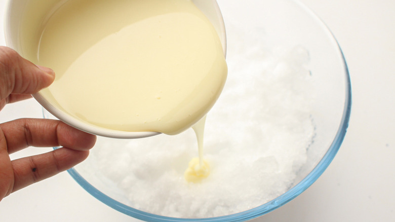 pouring condensed milk on ice