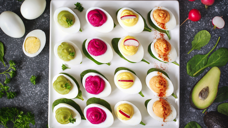 4 kinds of deviled eggs on a plate