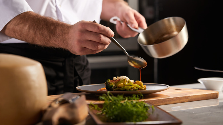 Chef plating a meal