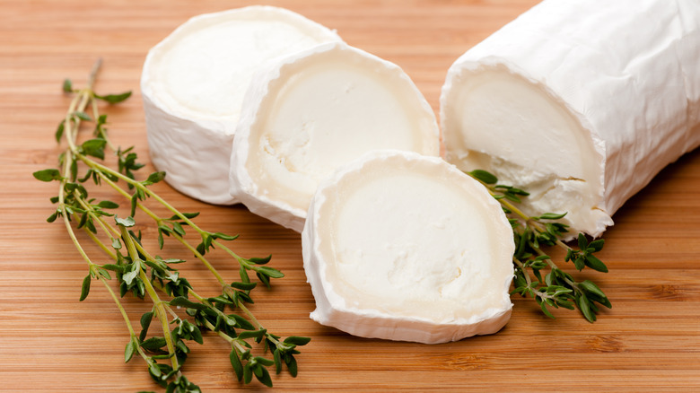 Goat cheese on cutting board 