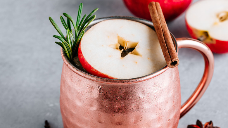 festive moscow mule with cinnamon, apple, and rosemary