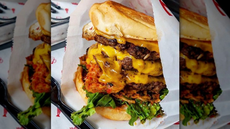 Wrapped Kimchi burger on tray