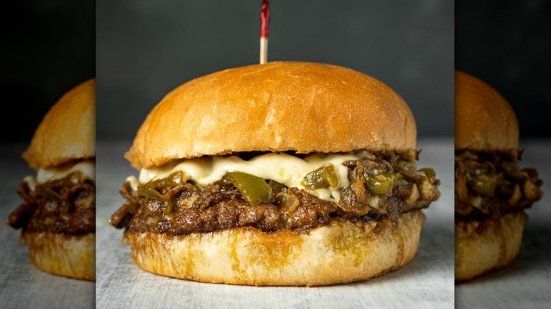 Philly cheesesteak burger on table