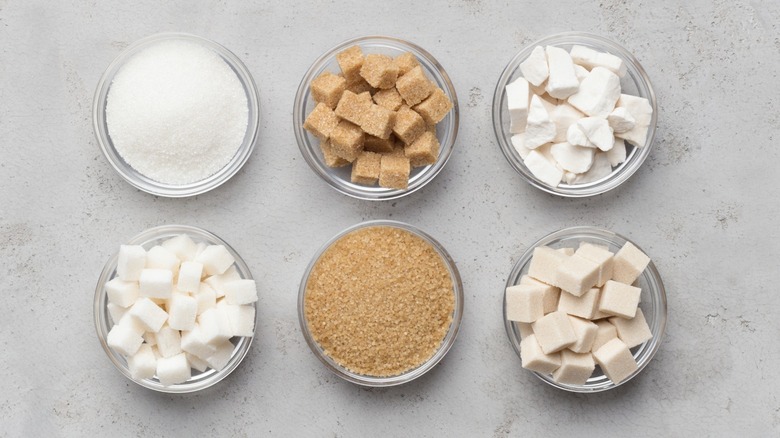 Various sugars in glass bowls