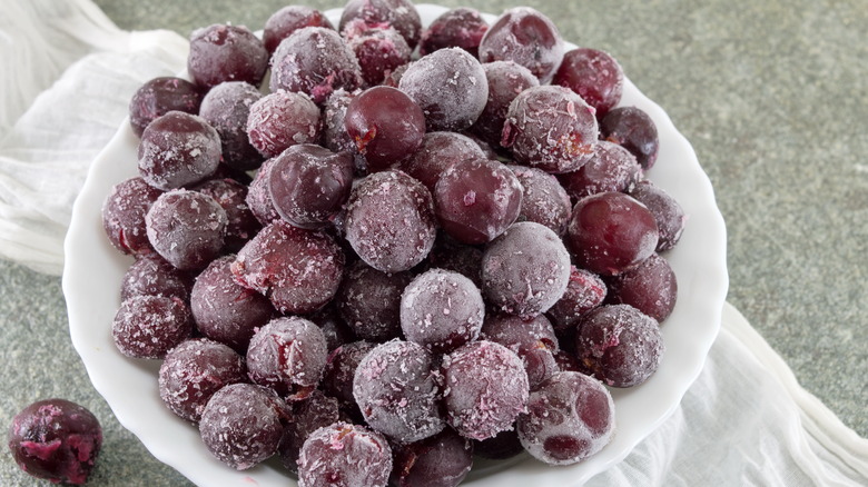 Frozen grapes in white bowl