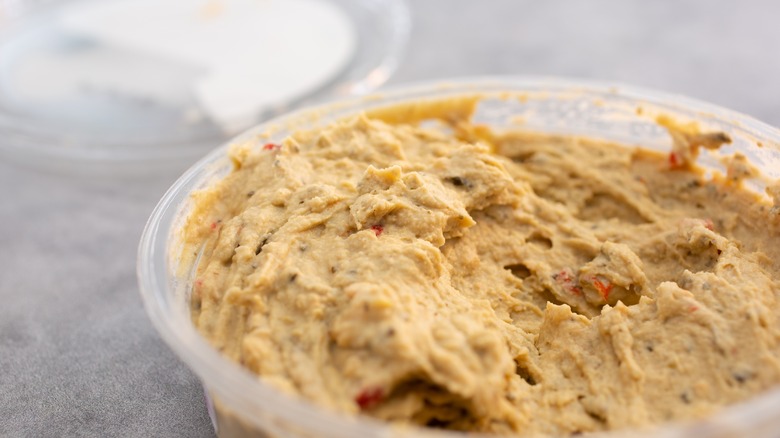 Store bought hummus in container