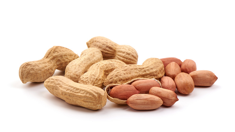 Shelled peanuts on white background