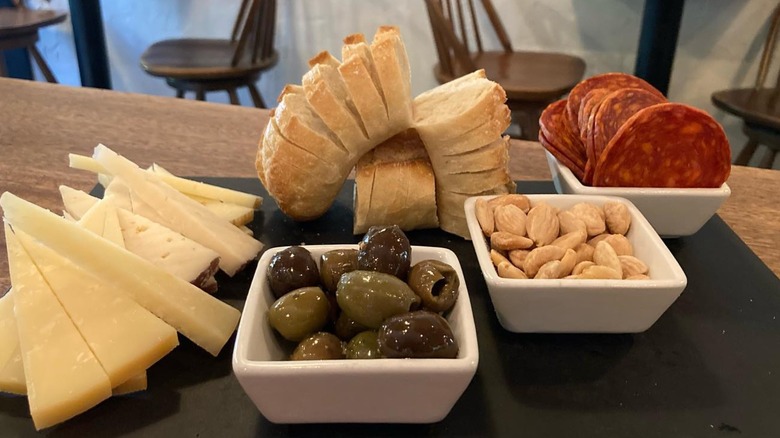 Basque cheese plate with olives