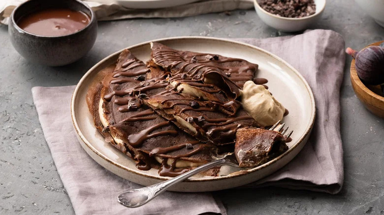Crepes with chocolate sauce on a plate