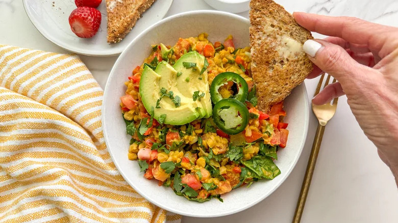 Chickpea scramble in a bowl with toast