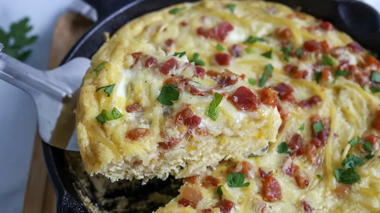 Spaghetti carbonara frittata in a cast iron pan